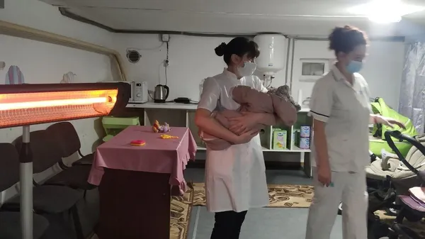 Наталія Горбачук тримає малюка