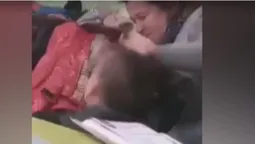 На Закарпатті вчителька схопила учня за чуб і трусила головою (відео)