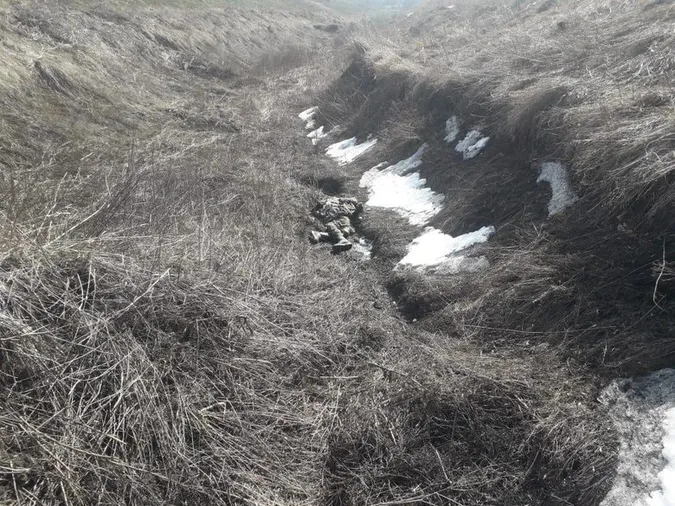 На Харківщині виявили трупи російських солдатів без слідів насильницької смерті (фото 18+)